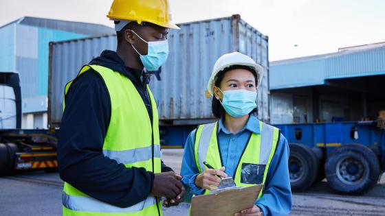 Shipyard workers in masks