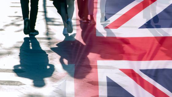 Shadows of people and Union Jack flag