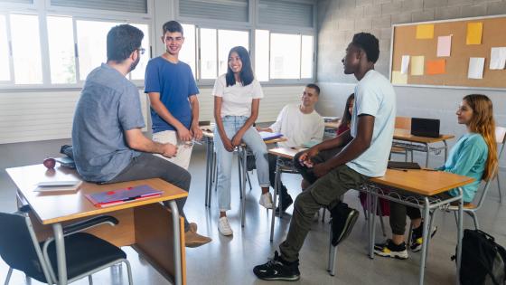 Students and mentor in a classroom