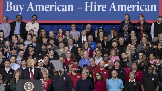 Trump speaking below "Buy American, hire American" banner